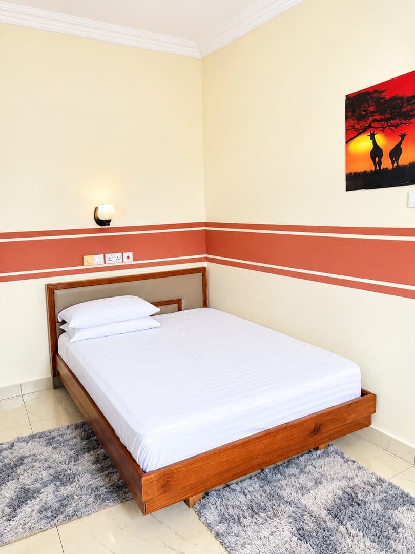Standard Room comfortable bed and decor